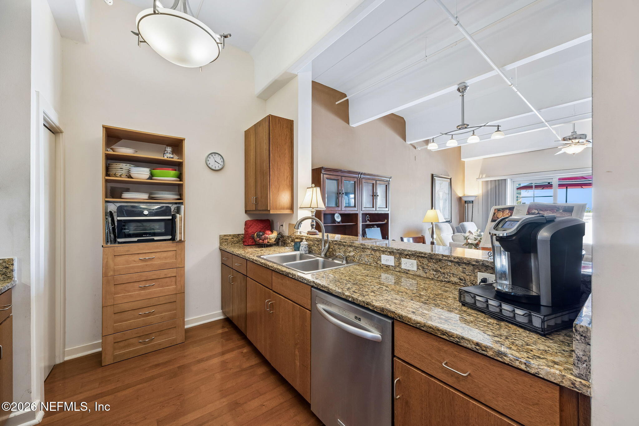 1661 Riverside Avenue, Unit 410 Jacksonville, FL 32204 - Photo 8 of 54 a kitchen with stainless steel appliances granite countertop a sink and a refrigerator