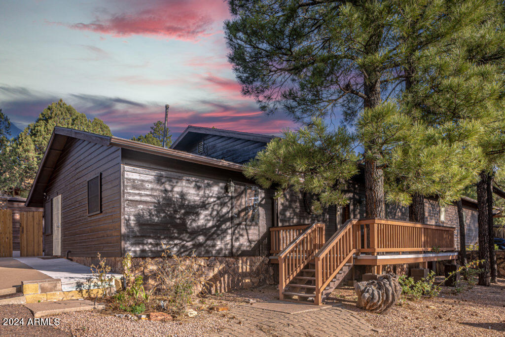 a view of a chair and table in the backyard