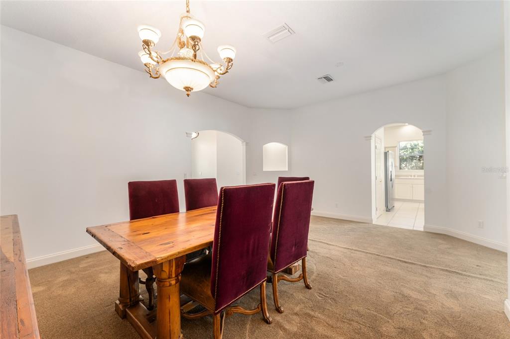 3003 Southwest 41st Place Ocala, FL 34474 - Photo 19 of 51 a view of a dining room with furniture