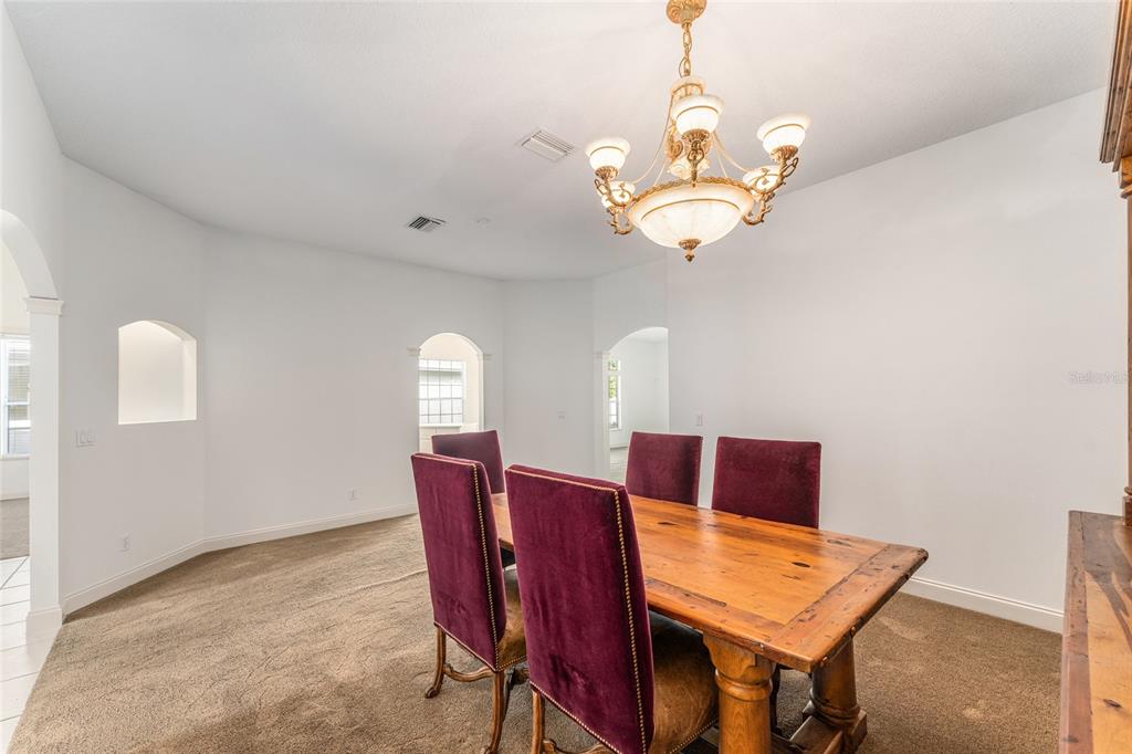 3003 Southwest 41st Place Ocala, FL 34474 - Photo 20 of 51 a dining room with furniture and window