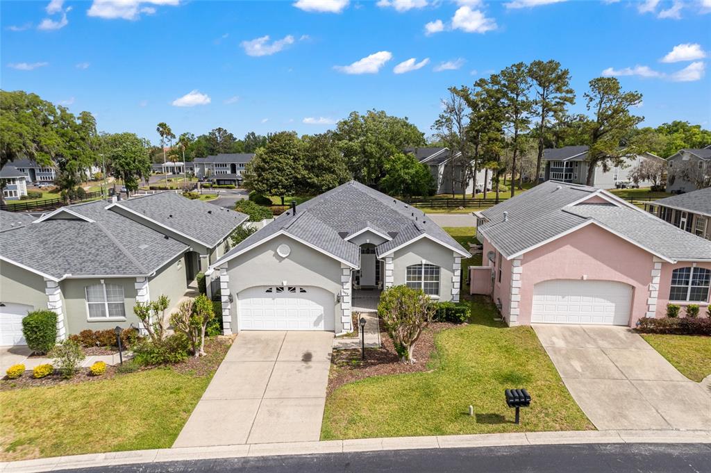 3003 Southwest 41st Place Ocala, FL 34474 - Photo 2 of 51 a front view of a house with garden
