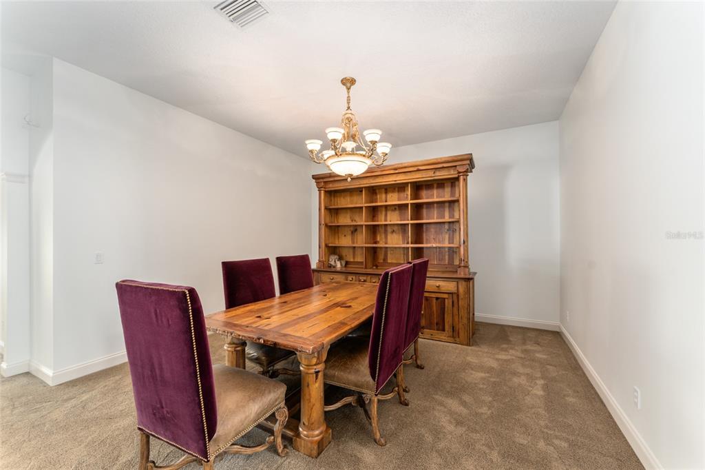 3003 Southwest 41st Place Ocala, FL 34474 - Photo 21 of 51 a workspace with furniture and chandelier