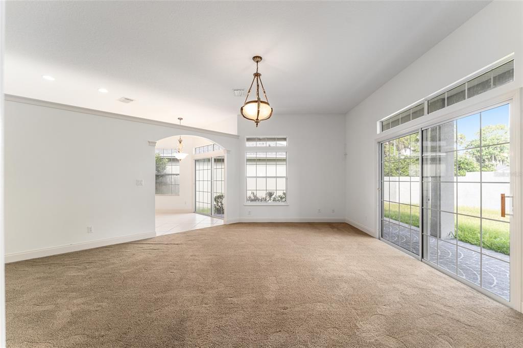 3003 Southwest 41st Place Ocala, FL 34474 - Photo 23 of 51 an empty room with windows and outdoor view