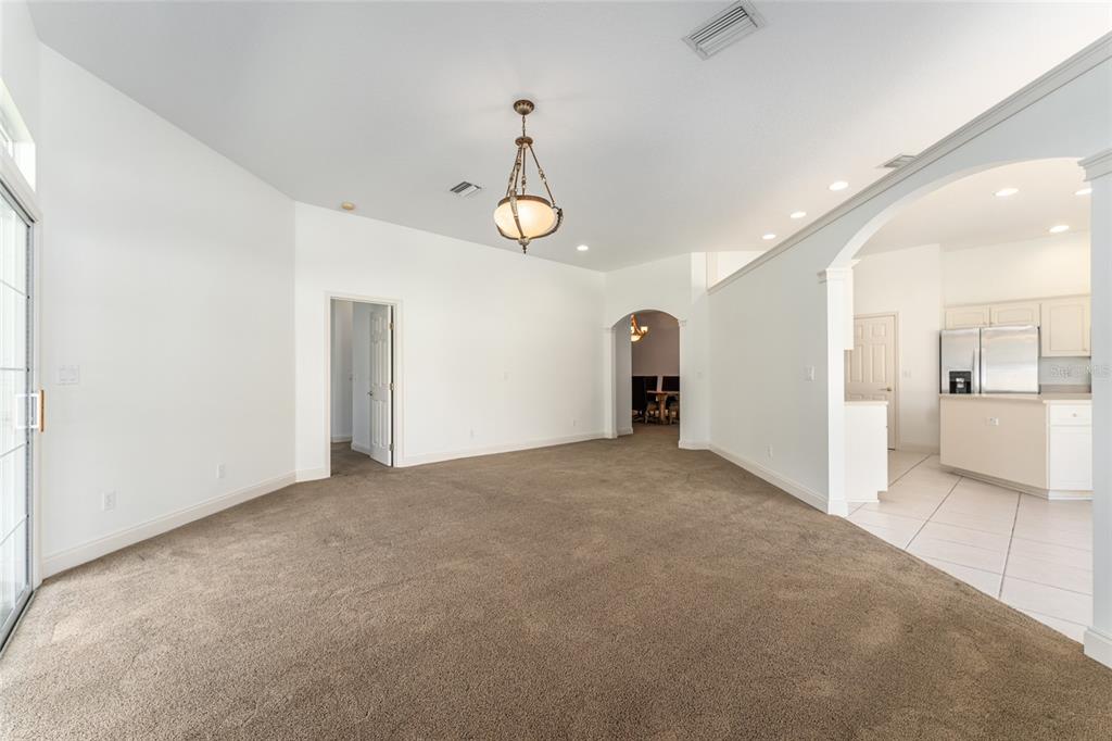 3003 Southwest 41st Place Ocala, FL 34474 - Photo 24 of 51 a view of a livingroom with a chandelier