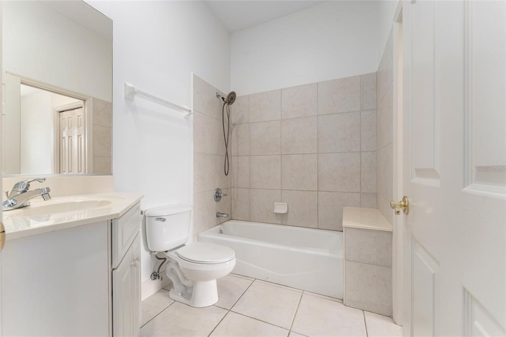 3003 Southwest 41st Place Ocala, FL 34474 - Photo 32 of 51 a bathroom with a toilet a sink and bathtub