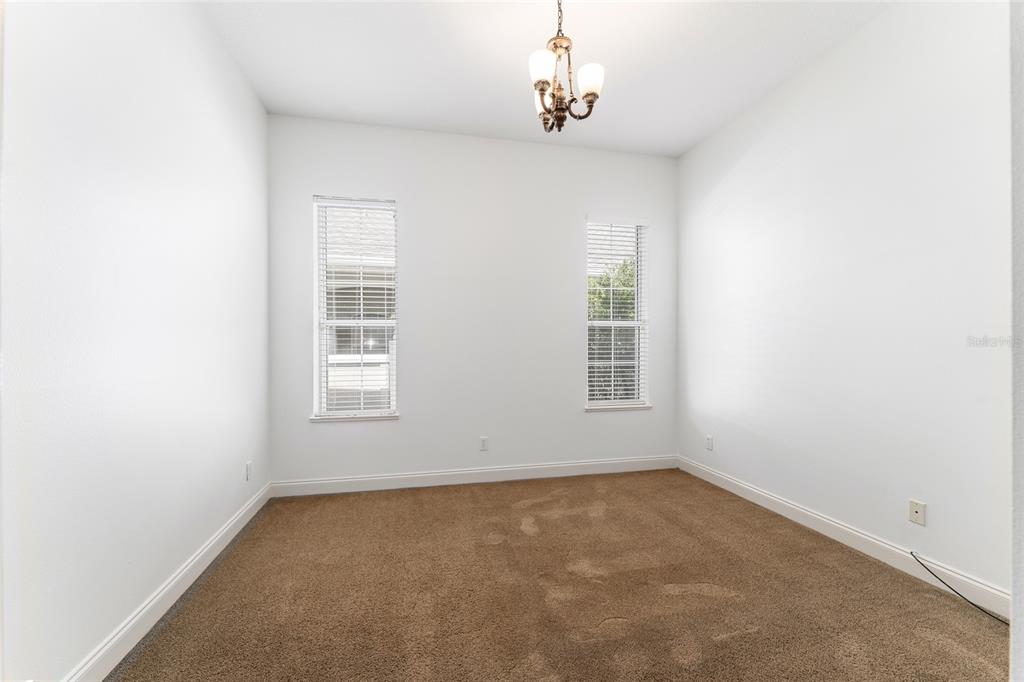 3003 Southwest 41st Place Ocala, FL 34474 - Photo 34 of 51 an empty room with windows