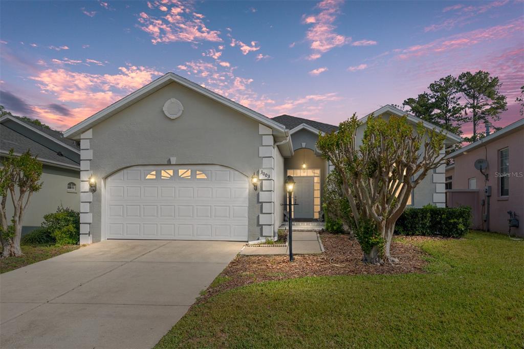 3003 Southwest 41st Place Ocala, FL 34474 - Photo 47 of 51 a front view of a house with a yard