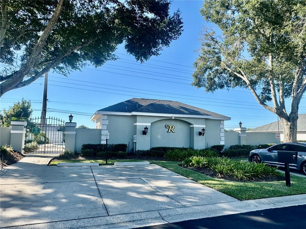 3003 Southwest 41st Place Ocala, FL 34474 - Photo 50 of 51 a front view of a house with a garden