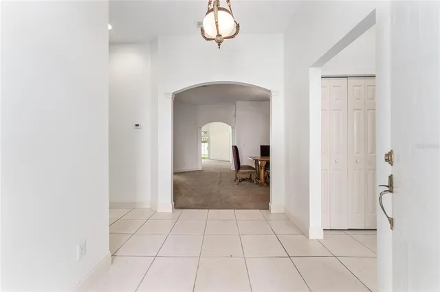 a view of a room with a barbeque and entryway