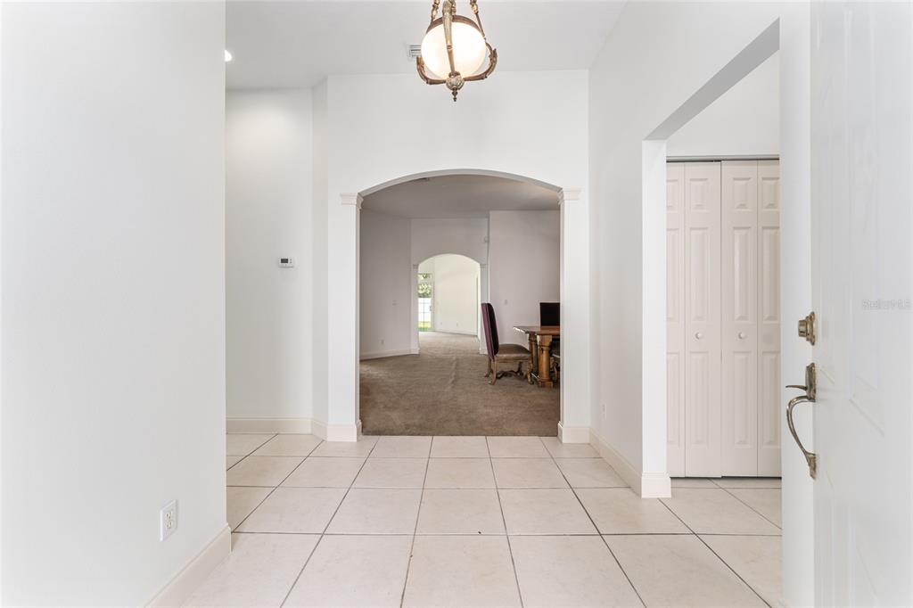 3003 Southwest 41st Place Ocala, FL 34474 - Photo 8 of 51 a view of a room with a barbeque and entryway