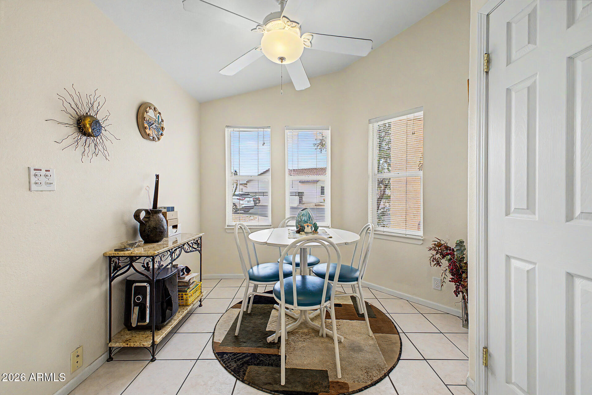 2101 South Meridian Road, Unit 45 Apache Junction, AZ 85120 - Photo 13 of 36 a dining room with furniture and window