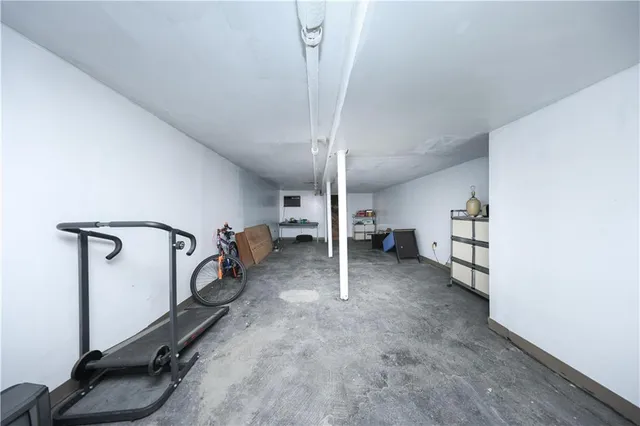 a front view of multi story building with retail shops