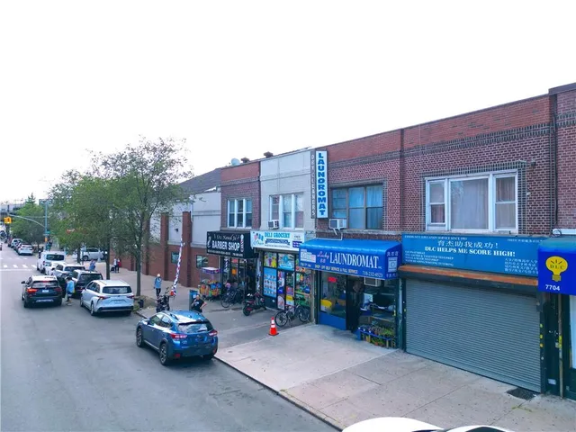 an aerial view of a building with a lake view
