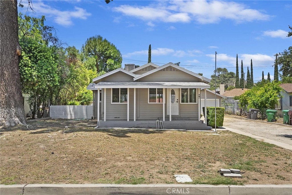 77 Pendleton Road Banning, CA 92220 - Photo 1 of 1 a front view of a house with garden