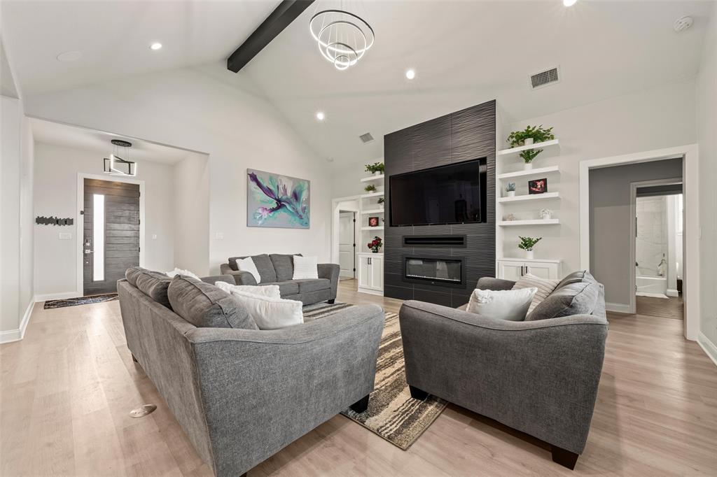 820 Forward Pass Drive Hewitt, TX 76643 - Photo 2 of 22 a living room with fireplace furniture and a flat screen tv