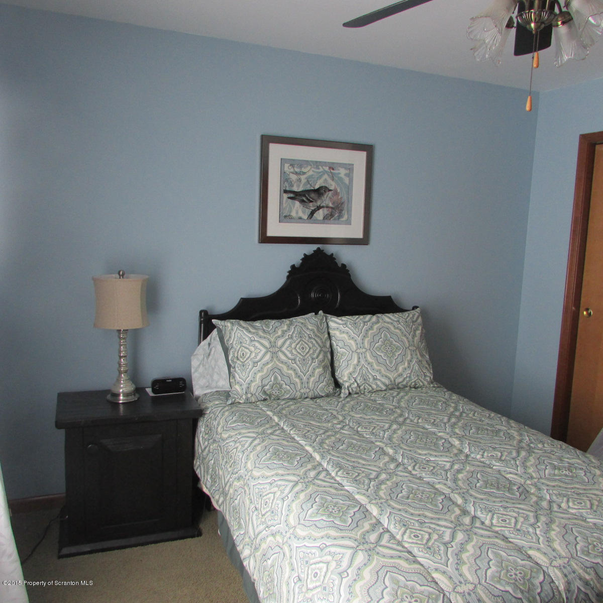 73 Taylor Road Montrose, PA 18801 - Photo 18 of 26 a bedroom with a bed and a lamp