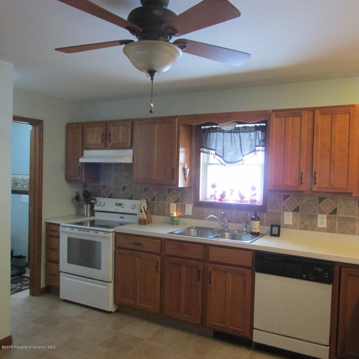 73 Taylor Road Montrose, PA 18801 - Photo 5 of 26 a kitchen with a sink stainless steel appliances and cabinets