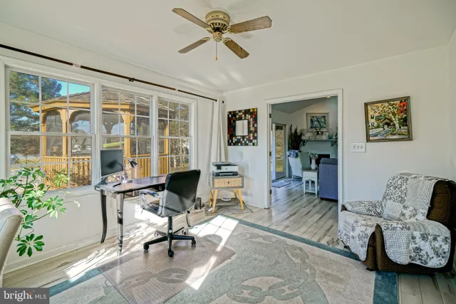 a workspace with furniture and a window