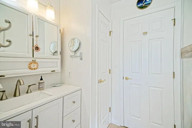 a bedroom with a bed and ceiling fan