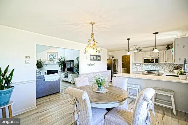 a view of a dining room with furniture and window