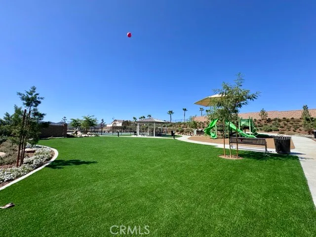 a view of a swimming pool with sitting area