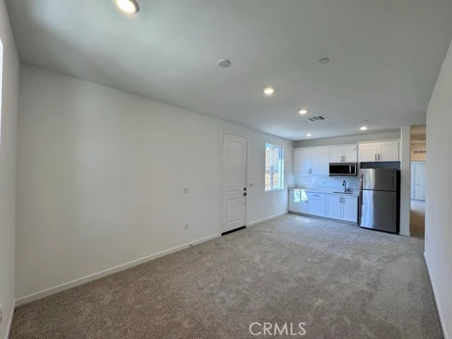 a view of a kitchen with a sink