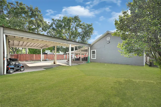 a view of a house with backyard porch and garden