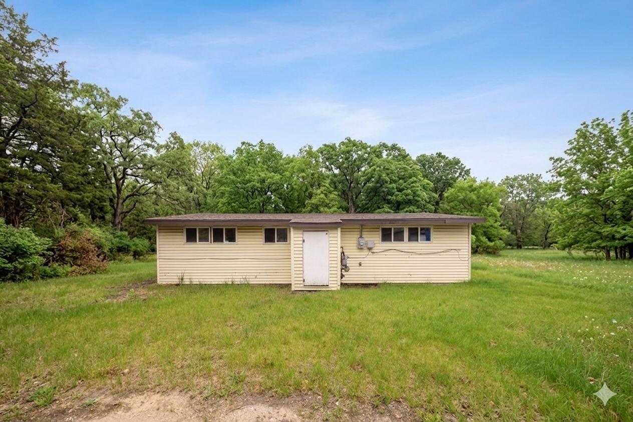 2280 Roosevelt Place Gary, IN 46404 - Photo 13 of 14 a white house with a big yard and large trees