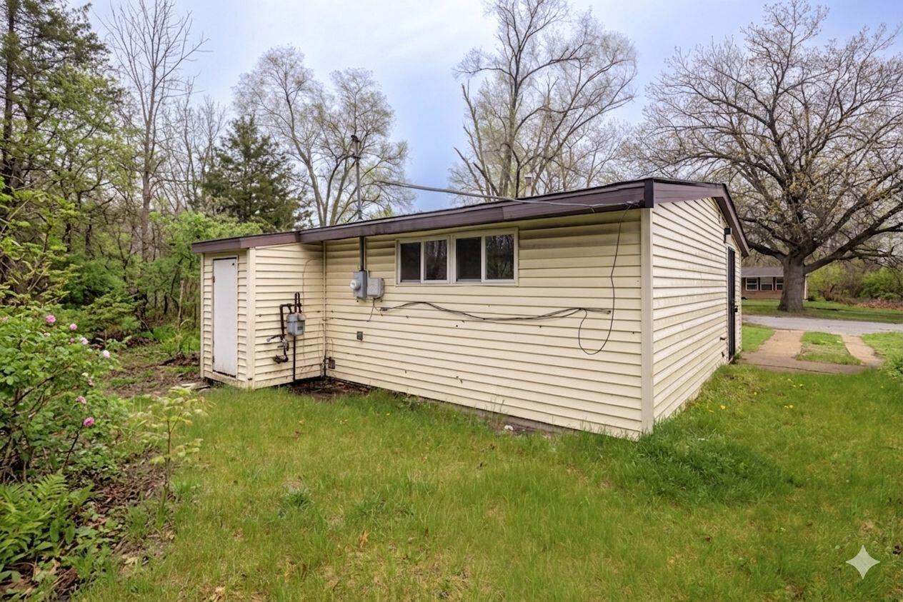 2280 Roosevelt Place Gary, IN 46404 - Photo 14 of 14 a view of a house with a yard