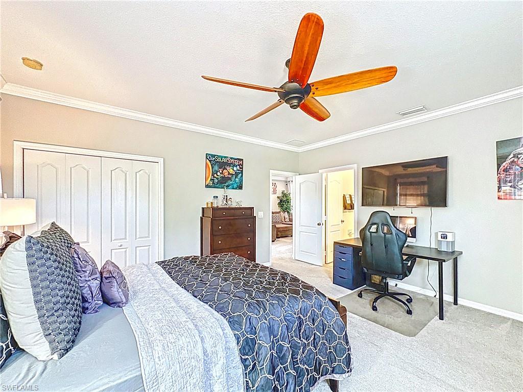 3032 Via Rialto Street Fort Myers, FL 33905 - Photo 14 of 26 a bedroom with a bed a desk and chair