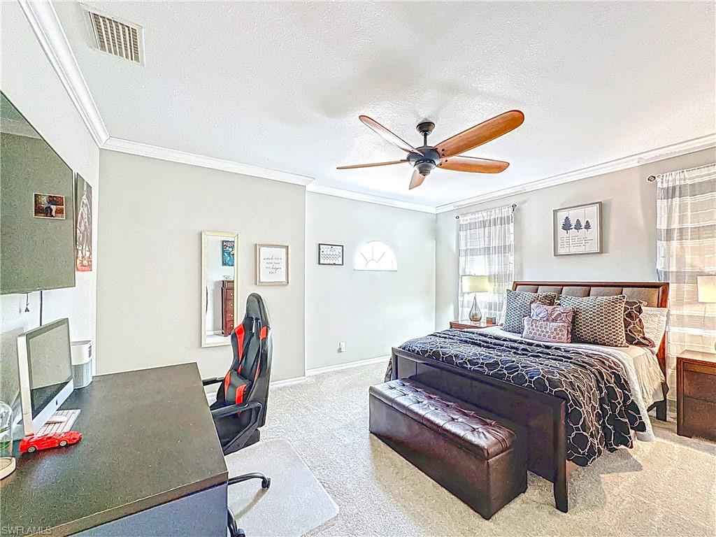 3032 Via Rialto Street Fort Myers, FL 33905 - Photo 15 of 26 a bedroom with a bed workspace and a window