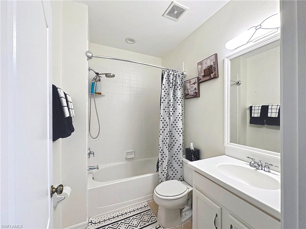 3032 Via Rialto Street Fort Myers, FL 33905 - Photo 16 of 26 a bathroom with a sink toilet a mirror and shower