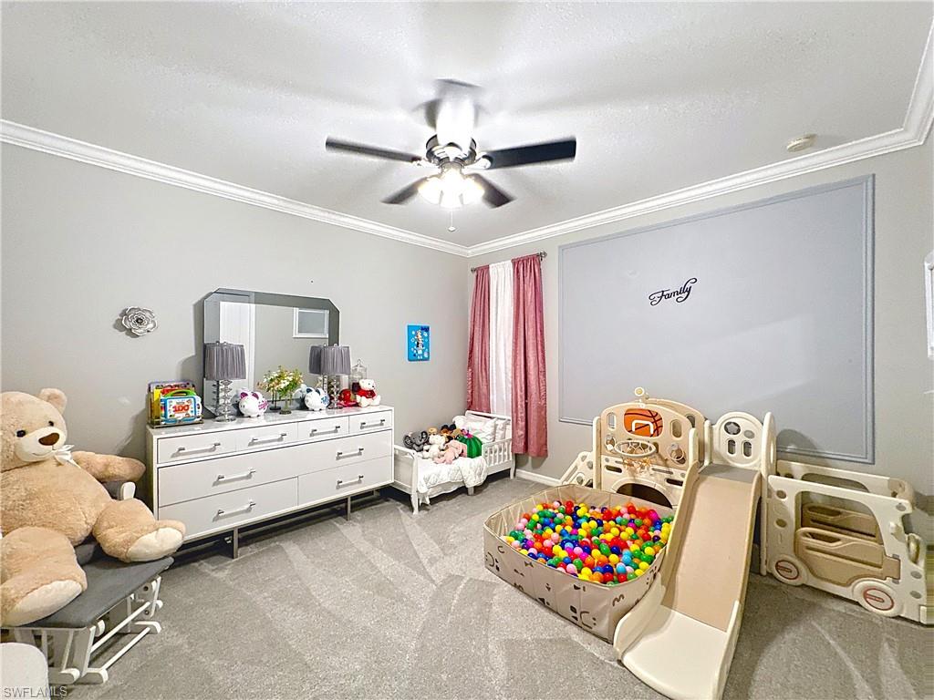 3032 Via Rialto Street Fort Myers, FL 33905 - Photo 19 of 26 a bedroom with furniture and a chandelier