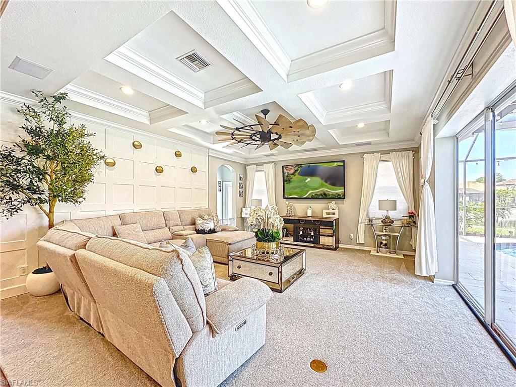 3032 Via Rialto Street Fort Myers, FL 33905 - Photo 2 of 26 a living room with furniture fireplace and large windows