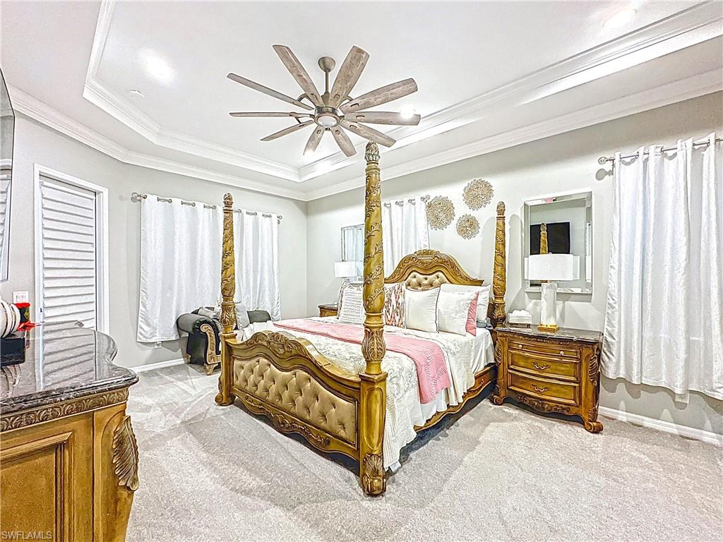 3032 Via Rialto Street Fort Myers, FL 33905 - Photo 9 of 26 a bedroom with a bed couch and window