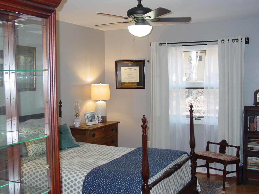 5170 Pine Crest Road Young Harris, GA 30582 - Photo 26 of 46 a bedroom with a bed and a chandelier