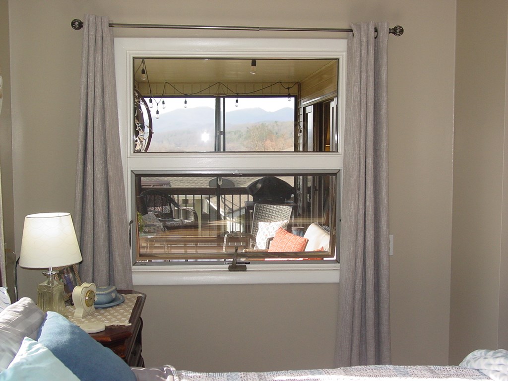 5170 Pine Crest Road Young Harris, GA 30582 - Photo 30 of 46 a living room with a bed and a window