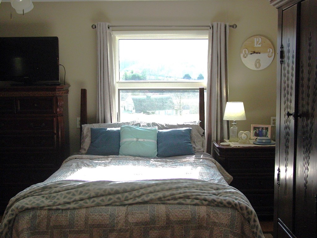 5170 Pine Crest Road Young Harris, GA 30582 - Photo 44 of 46 a bed sitting in a bedroom next to a window next to a window