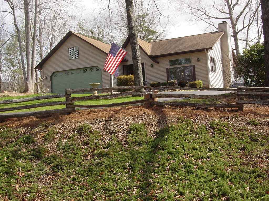 5170 Pine Crest Road Young Harris, GA 30582 - Photo 6 of 46 a front view of a house with a yard