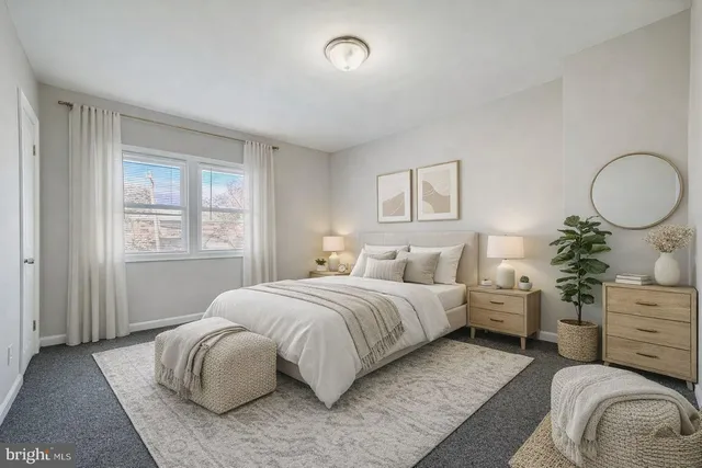 a bedroom with bed and a window