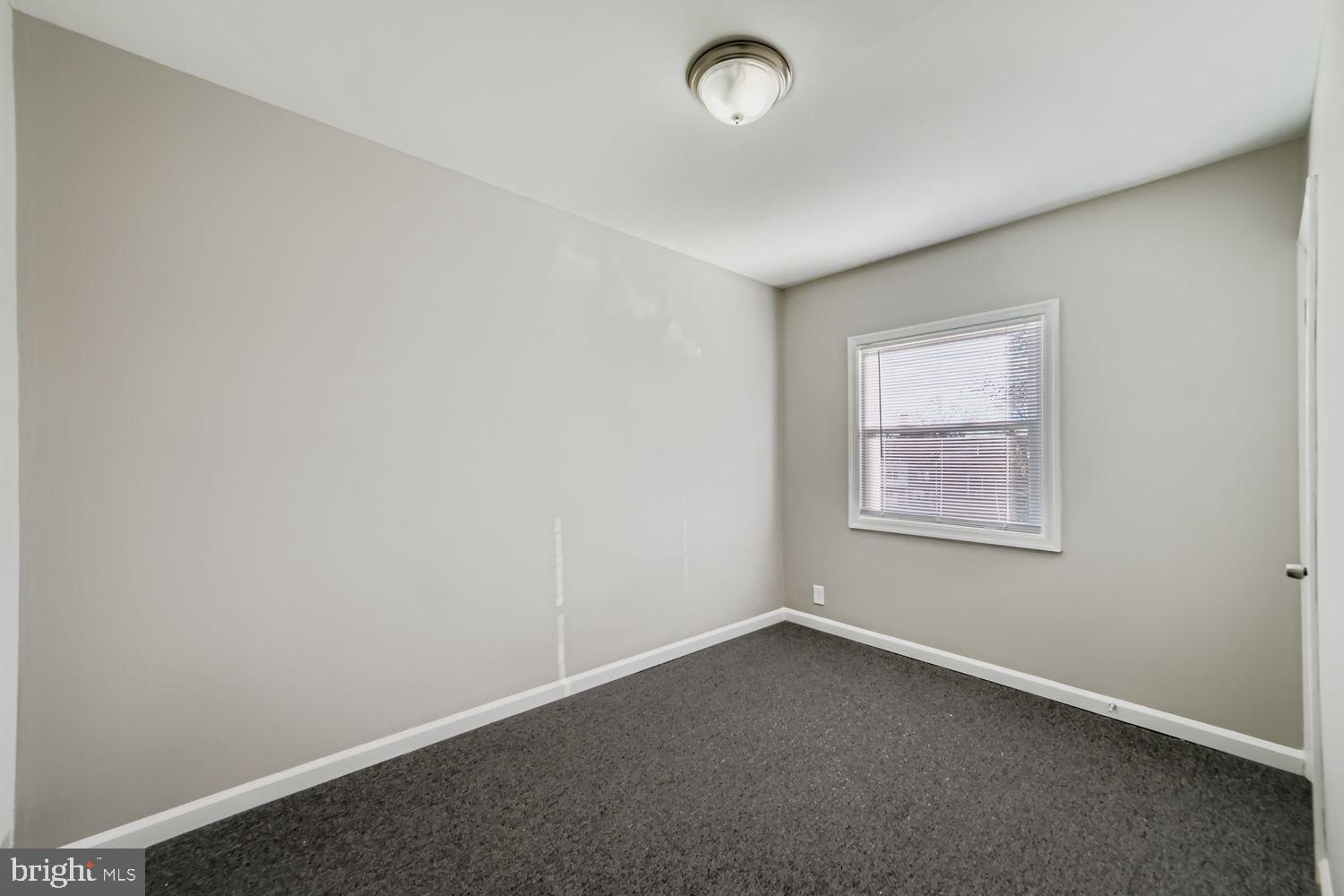 3731 10th Street Baltimore, MD 21225 - Photo 19 of 32 an empty room with a window
