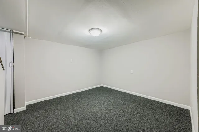 an empty room with a empty space and window