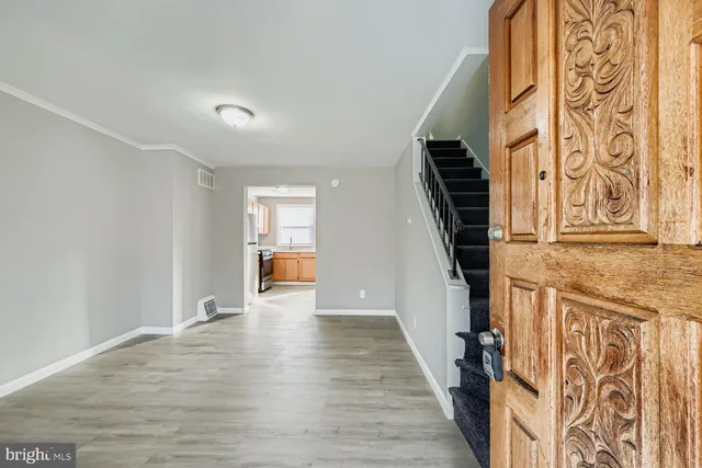 a view of an entryway with wooden floor