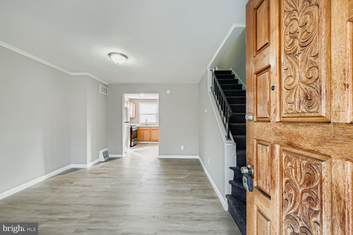 3731 10th Street Baltimore, MD 21225 - Photo 3 of 32 a view of an entryway with wooden floor