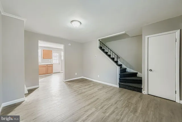 a view of entryway with wooden floor and stairs