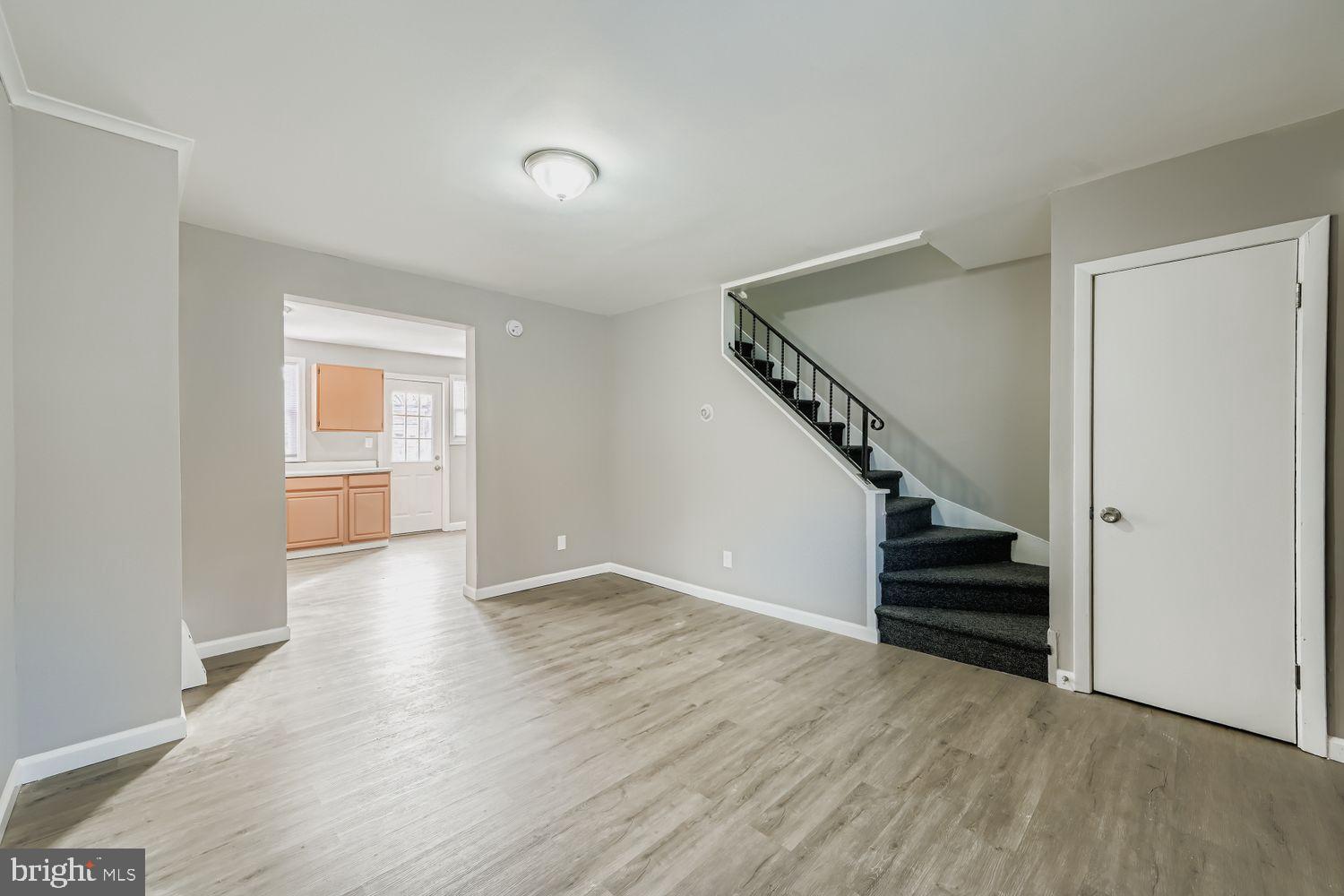 3731 10th Street Baltimore, MD 21225 - Photo 6 of 32 a view of entryway with wooden floor and stairs