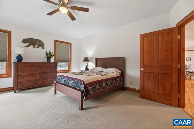 a en suite bathroom with a double vanity sink and a mirror