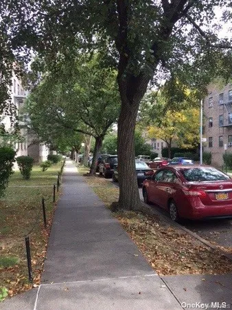 a view of street with parked cars