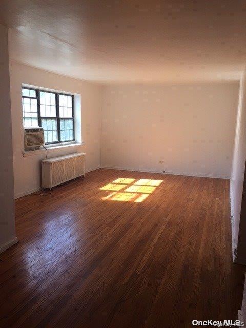 78-39 147th Street, Unit 1R Queens, NY 11367 - Photo 3 of 8 a view of an empty room and window