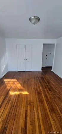 a kitchen with granite countertop a sink a stove a refrigerator and cabinets